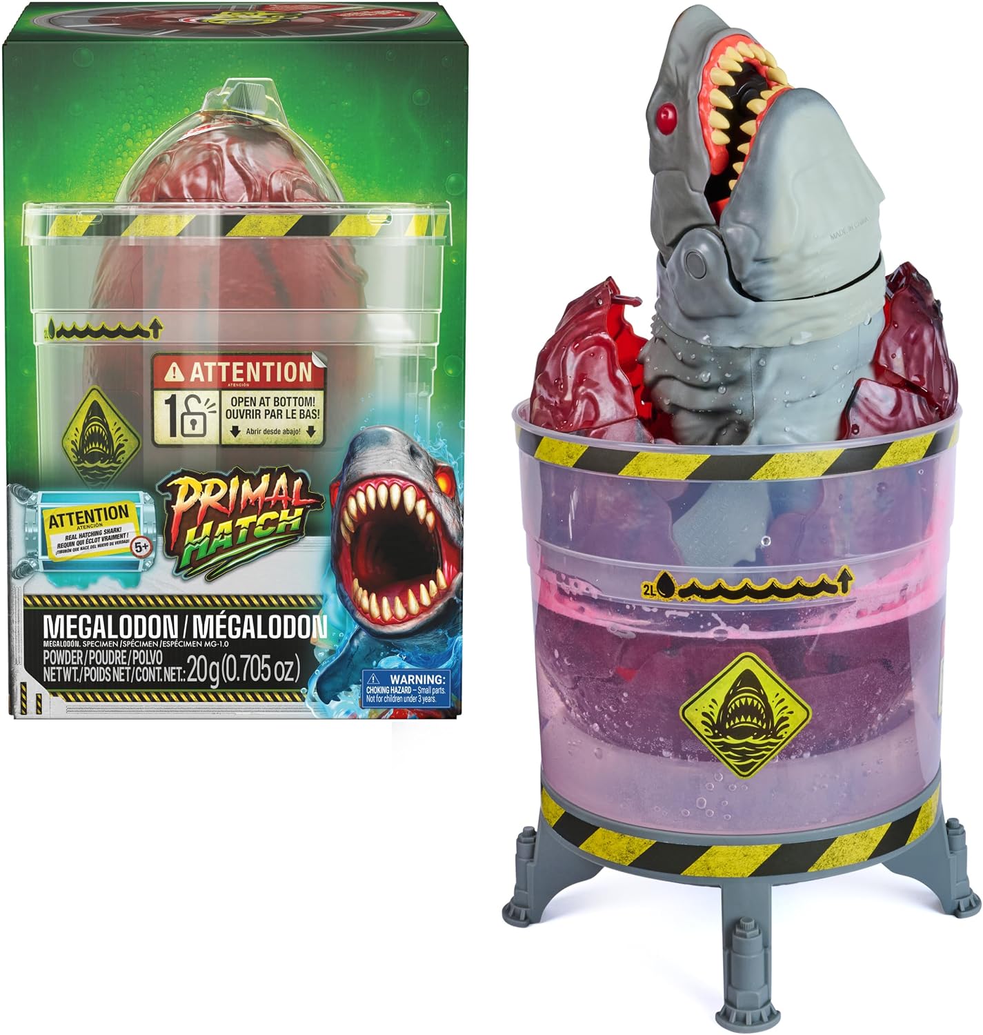 The Primal Hatch Megalodon shark bursting from its tank beside the retail box